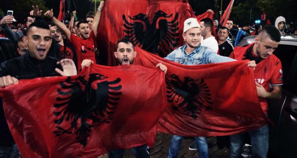 Albanian protestors with flags